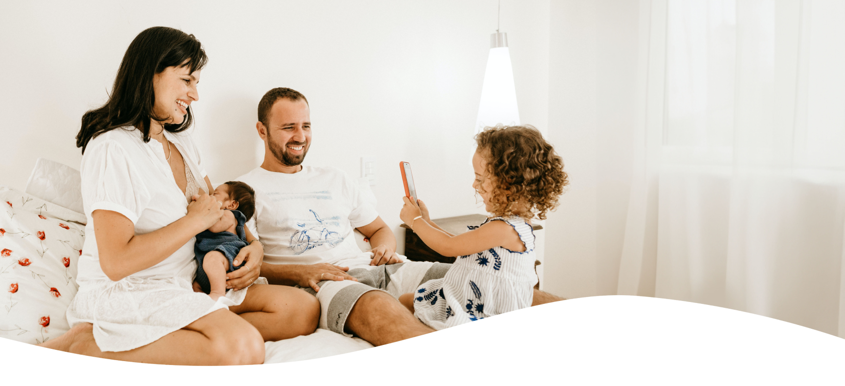 A happy family sharing a moment for their baby book, with a toddler taking a photo to add to their family album, capturing the essence of cherished family memories.